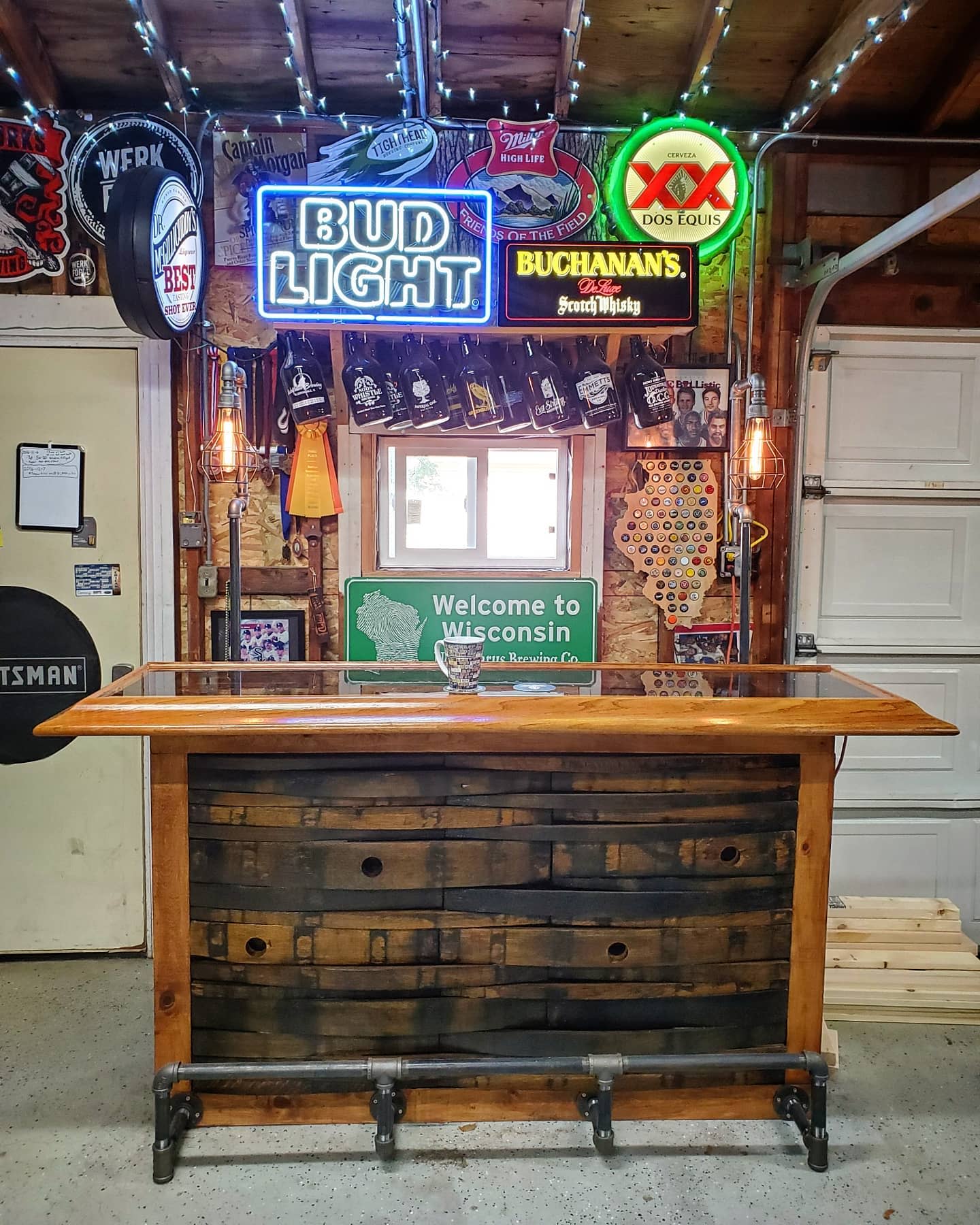 garage wood wet bar beer signs hanging bottles 